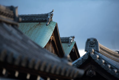 Low angle view of roof of building against sky
