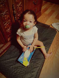 High angle portrait of cute girl at home