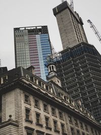 Low angle view of buildings against sky in city