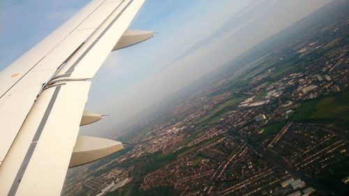 Aerial view of cityscape against sky