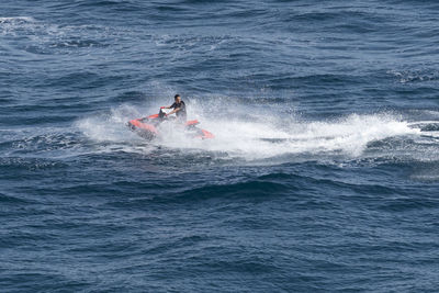 Man surfing in sea