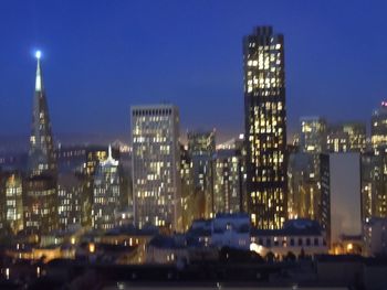 Illuminated cityscape at night