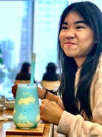 Portrait of a girl sitting on table