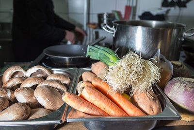 Midsection of man in kitchen