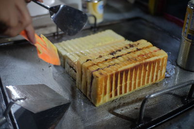 Close-up of person preparing food