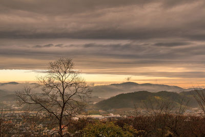 Scenic view of mountains against dramatic sky