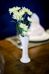 Close-up of white flower vase on table