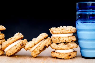 Close-up of cupcakes on table against black background