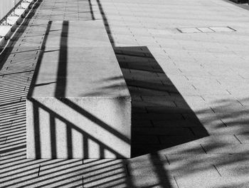 High angle view of shadow on footpath