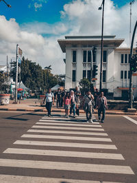 Group of people crossing road