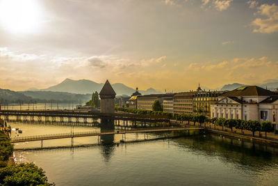 Aerial view over chapel bridge and city in golden hour in lucerne, switzerland.