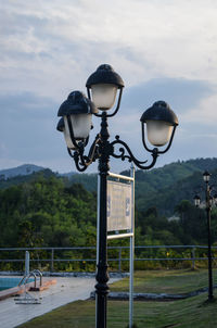 Street light against sky