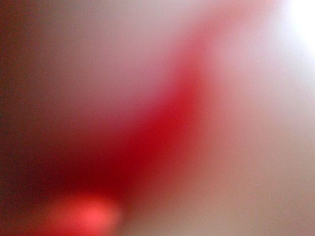 EXTREME CLOSE UP OF ORANGE LIGHT