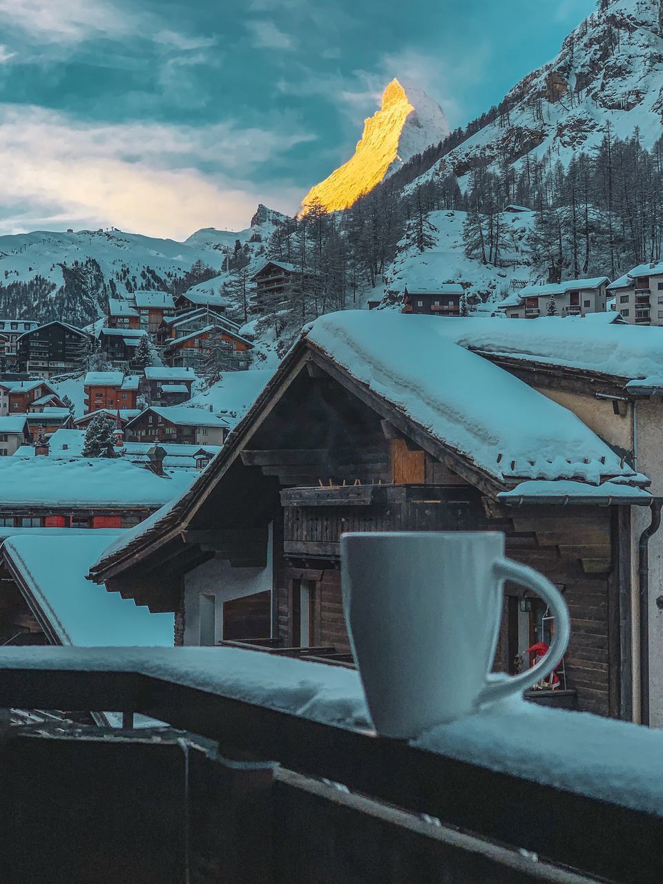 COFFEE CUP AGAINST SKY SEEN THROUGH GLASS