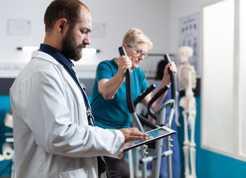 Side view of doctor working at clinic