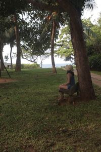 Man sitting on seat in field