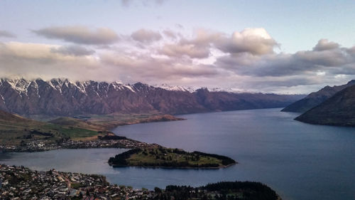 Scenic view of lake and mountains against sky