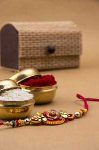 Close up of rakhi on beige background