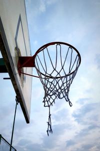 Low angle view of basketball hoop against sky