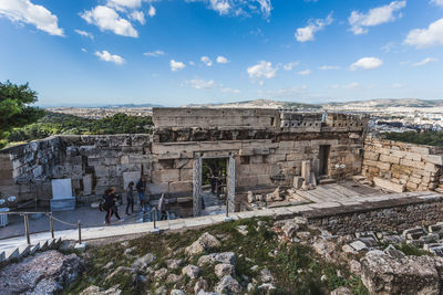 Group of people in front of historical building, in the parthenon, athens