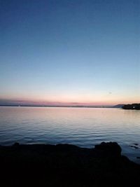 Scenic view of sea against sky at sunset