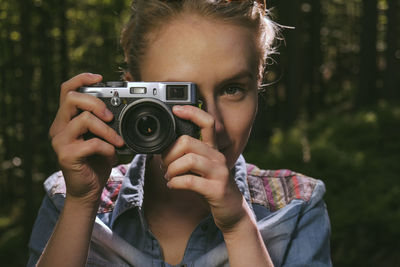 Portrait of woman photographing