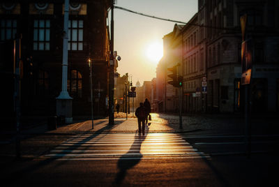 Buildings in city at sunset