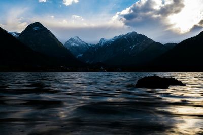 Scenic view of lake with mountains in background