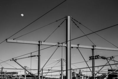 Low angle view of cables against sky