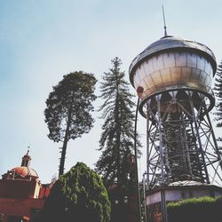 Low angle view of water tower against sky