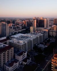 High angle view of buildings in city against sky