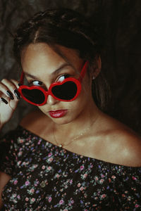 Close-up of young woman wearing sunglasses