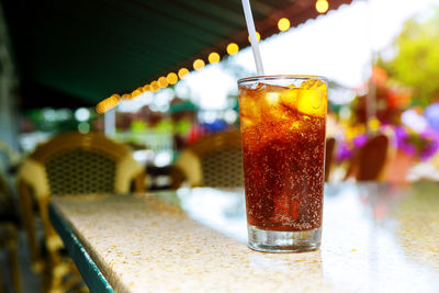 Close-up of cold drink on table