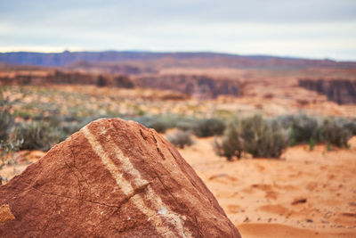 Rock on land against sky
