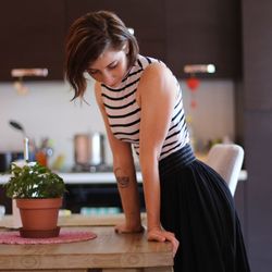 Mid adult woman standing at home