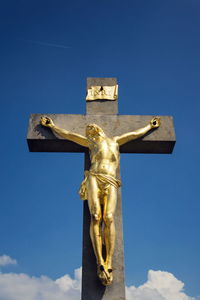 Low angle view of statue against clear blue sky