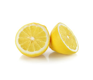 Close-up of yellow slices over white background