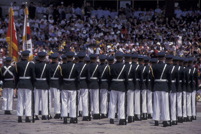 Rear view of soldiers marching during parade