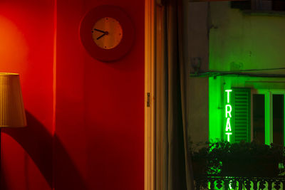 Illuminated light painting on wall of building