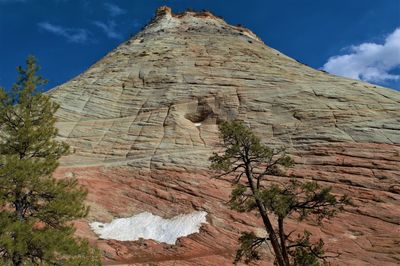 Low angle view of rock formation against sky