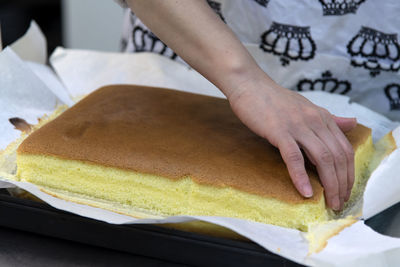 Midsection of person preparing food on table