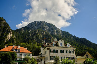 Buildings in town against sky