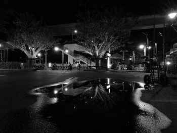 Illuminated city street at night