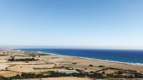 Scenic view of beach against clear sky