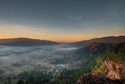 Scenic view of mountains against sky during sunset