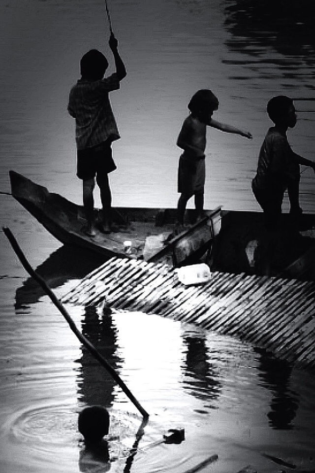 water, lifestyles, leisure activity, full length, togetherness, men, reflection, rear view, boys, pier, childhood, lake, bonding, sea, standing, person, walking, girls