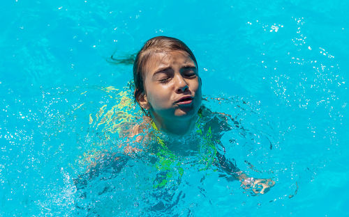 High angle view of girl in swimming pool