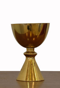 Close-up of glass on table against white background