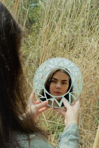 Portrait of a girl holding plant