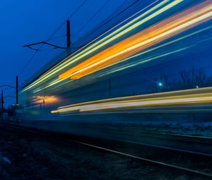 Train on railroad track at dusk